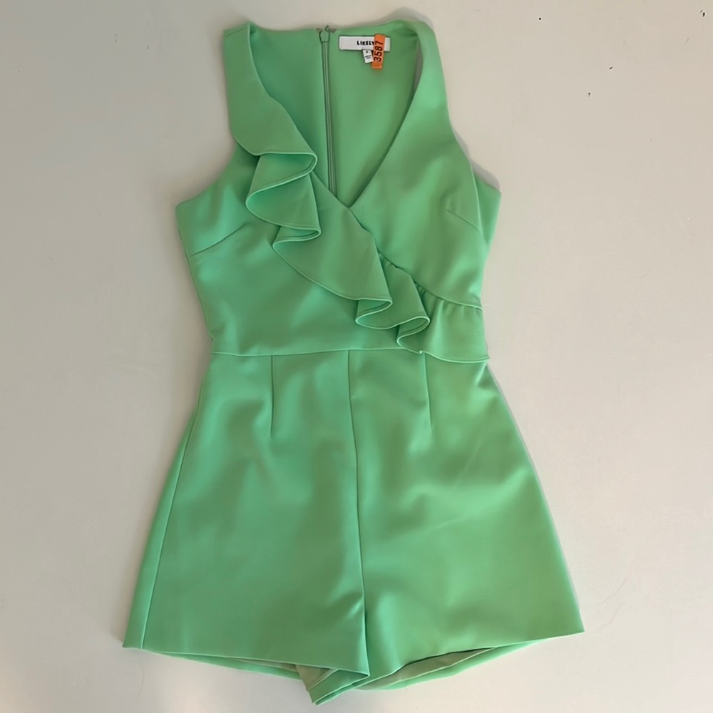 Green likely romper size 0 like new condition